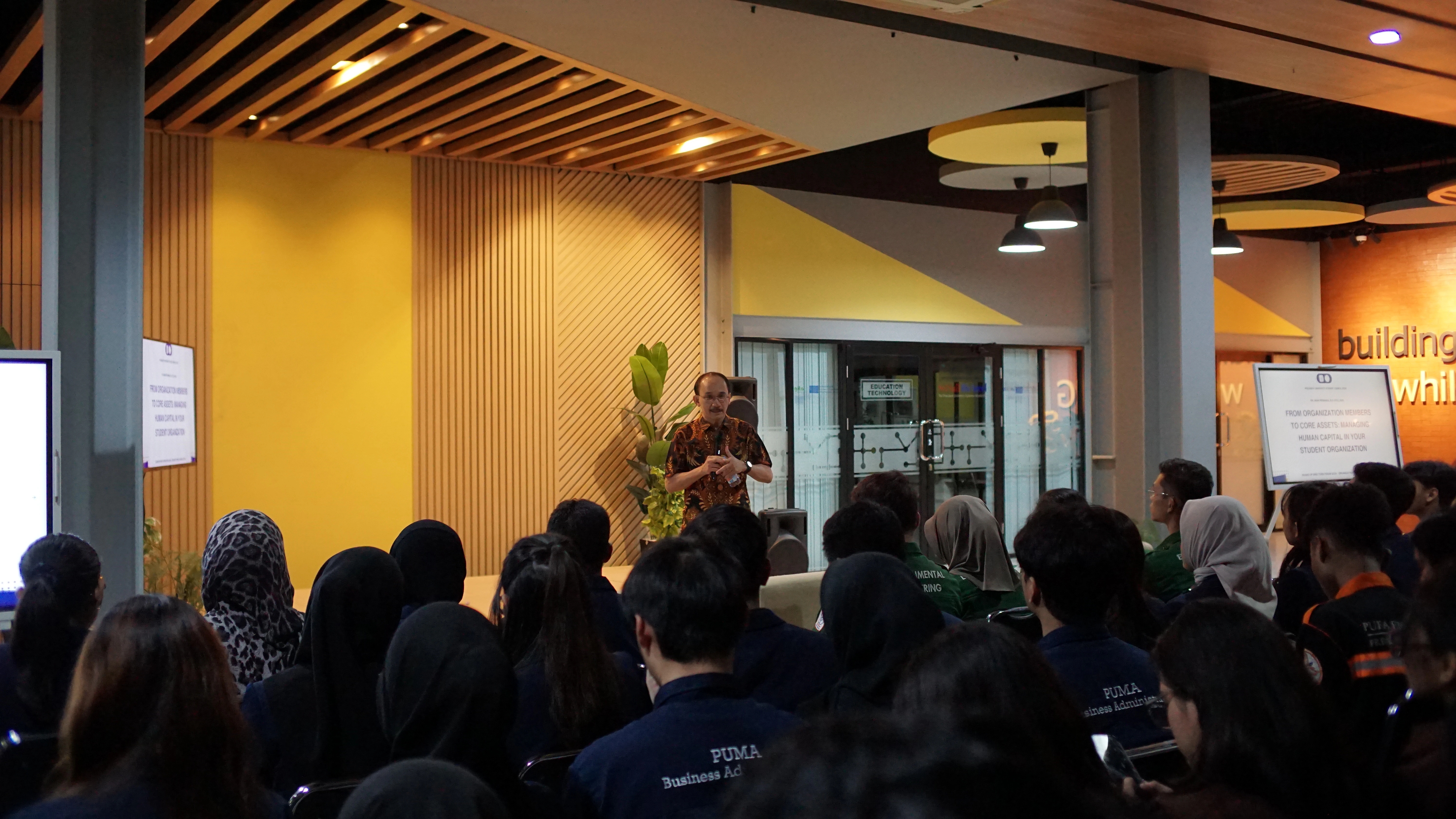 Dr. Iman Permana receiving token of appreciation